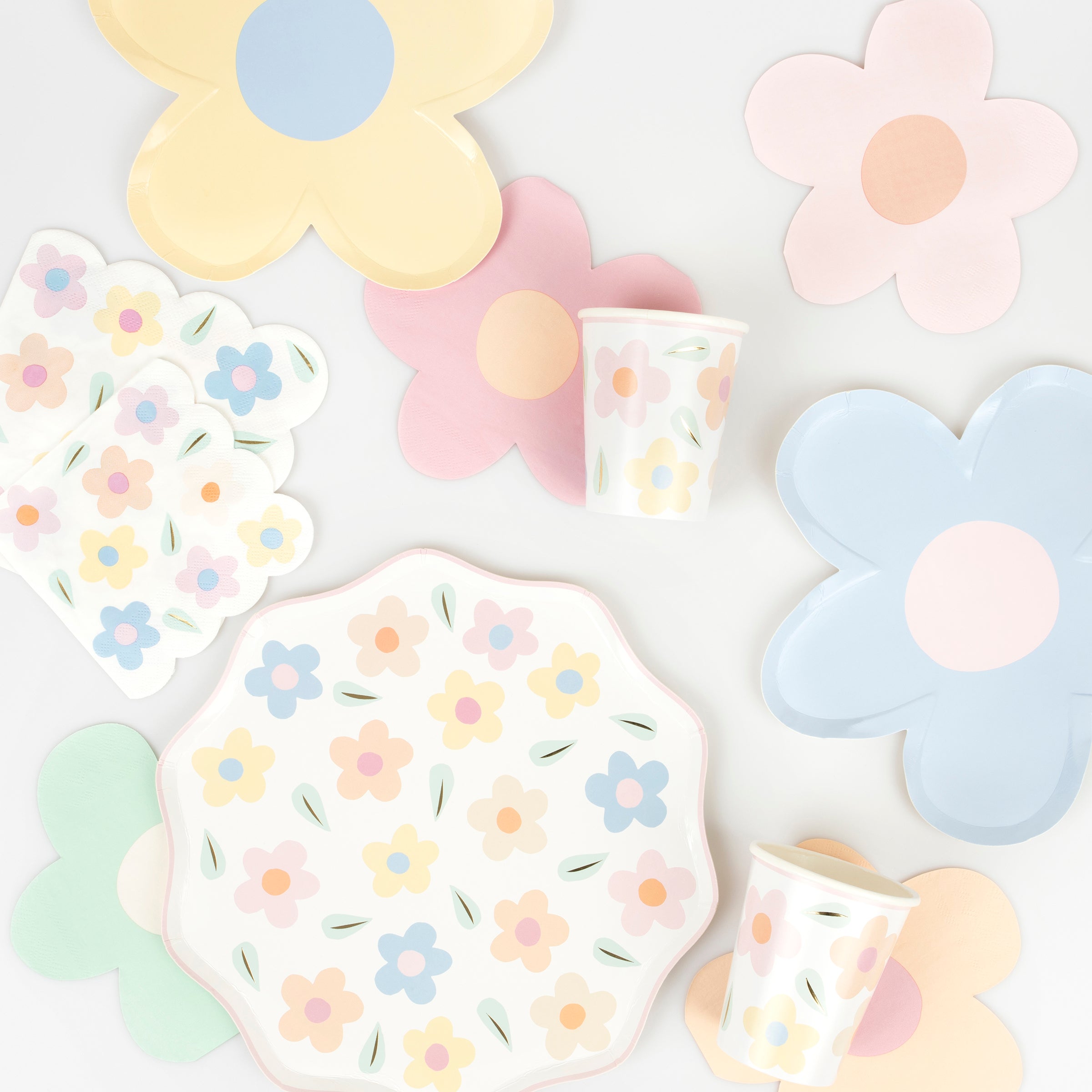 Our paper plates, with floral designs, have pink scalloped borders and shiny gold foil details.