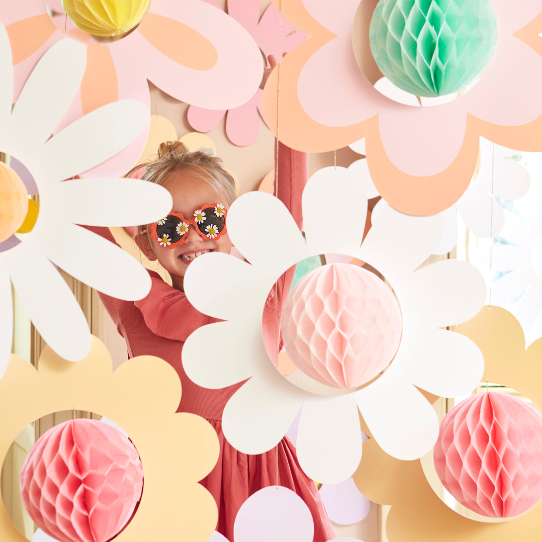 Our flower hanging decorations, with 3D honeycomb centres, are perfect for a pink party, groovy party or summer party
