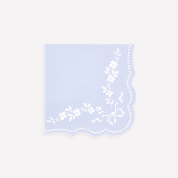 Our small paper napkins are made in cornflower blue with a white ornate design and sculptured edges, perfect for any sophisticated table setting. Image1