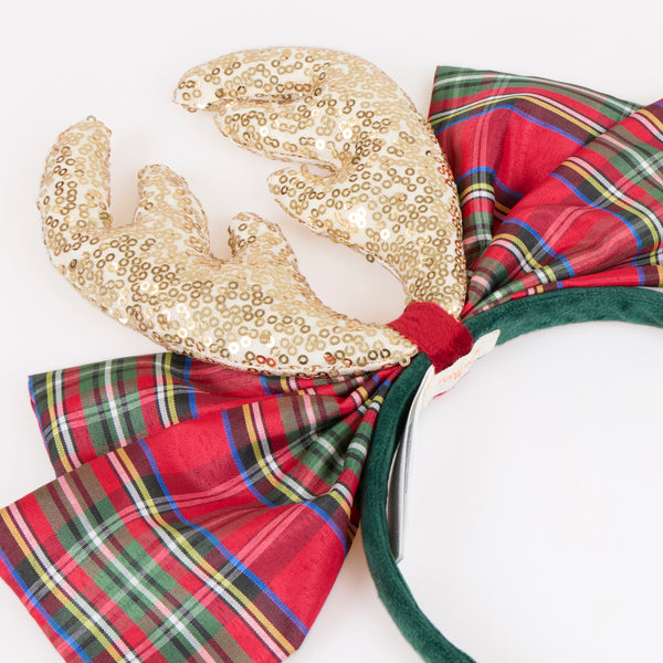 Dress up this Christmas with our fun reindeer antler headband, with gold sequin fabric antlers, a big tartan bow and a velvet headband, so stylish. Image3