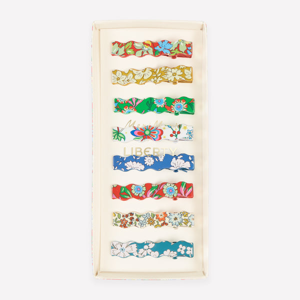 Our Christmas hair clips feature 8 different Liberty floral print designs and an elegant wavy shape, perfect to elevate your festive hair styles. Image1