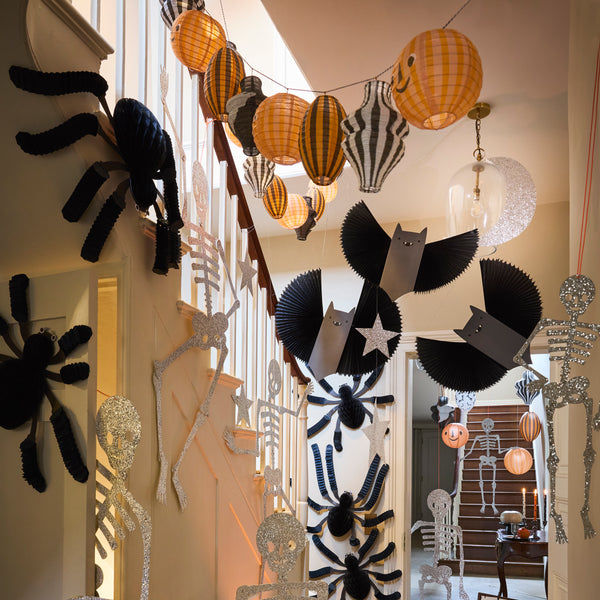 Our Halloween hanging decorations set features happy black bats with concertina wings and shimmering glitter stars and a moon. Image2