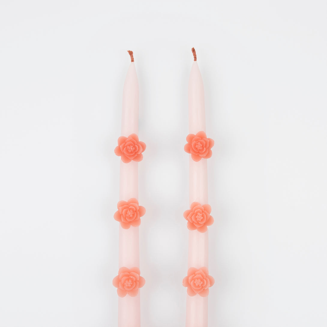 Make any pink party look amazing with our taper candles with pink flowers and pink wicks.