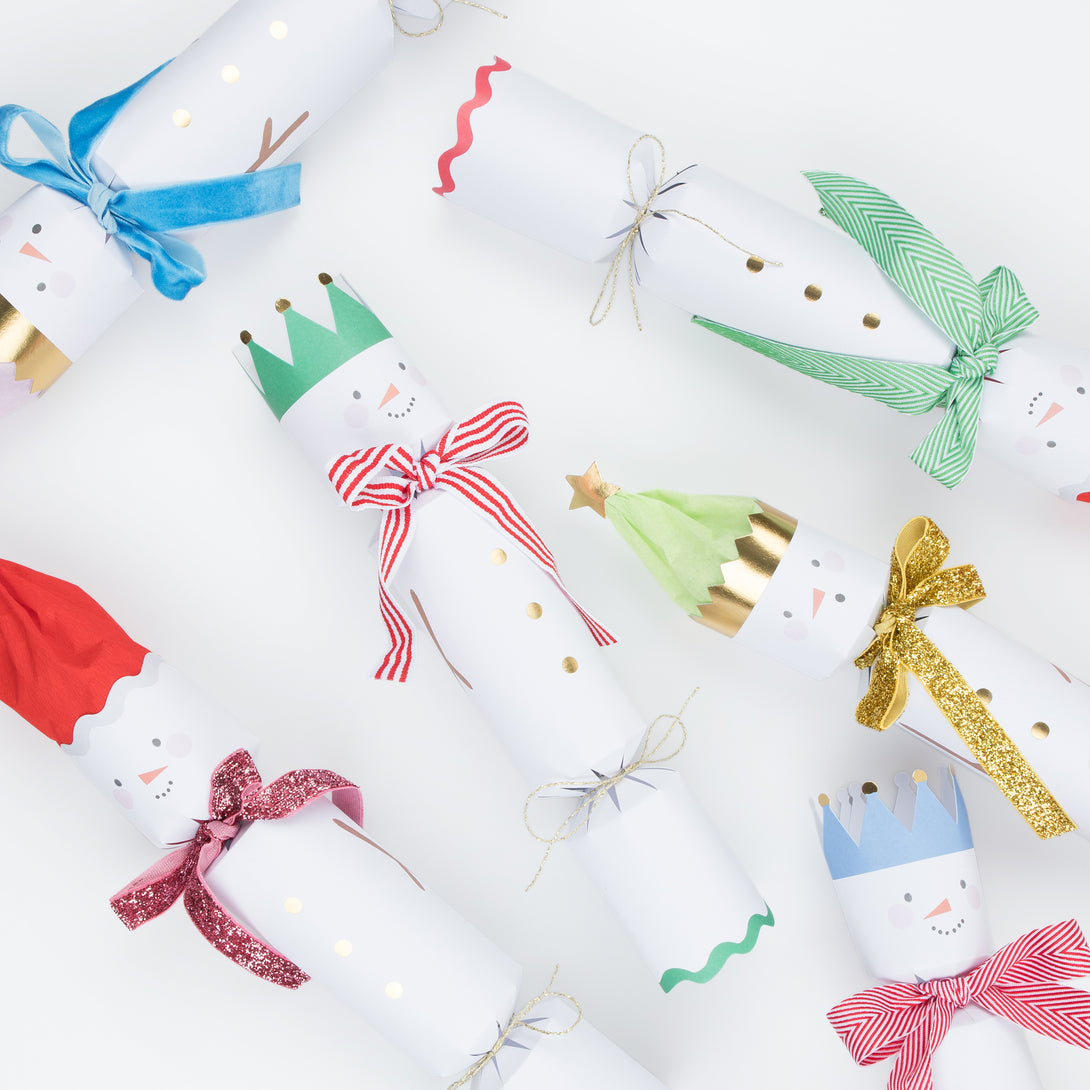 Our fun Christmas crackers have fun snowmen details with hat and scarf embelllishments, and contain fabulous erasers, party hats and jokes.