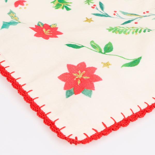 Our Christmas placemats, made from a linen and cotton mix, feature Santa in a folk-inspired scene, with gold embroidery and a crochet trim. Image6