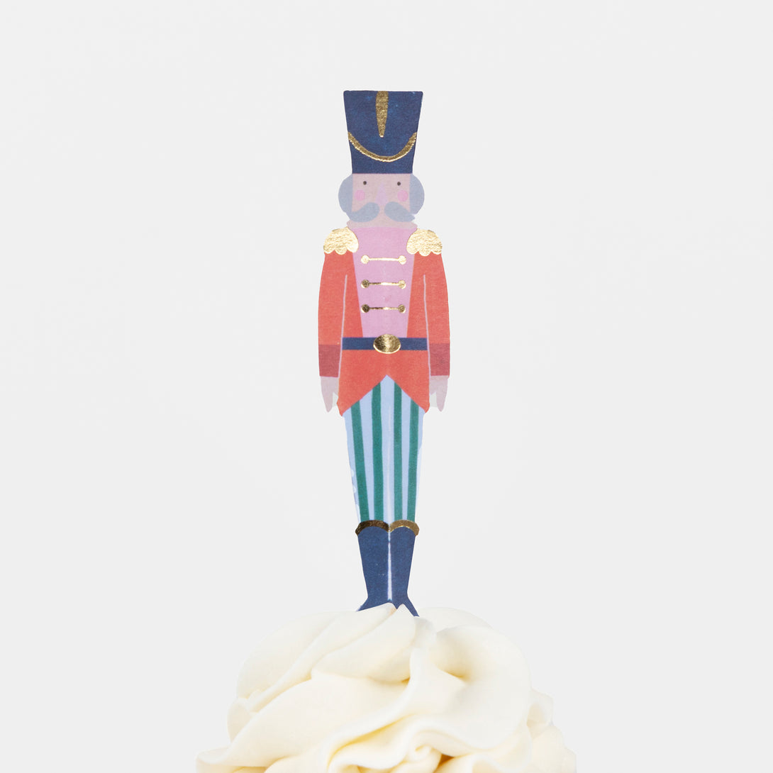 Our cupcake kit features classic Nutcracker character cake toppers and striped cupcake cases, ideal for Christmas treats. Image6