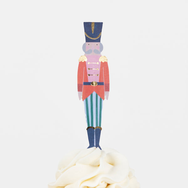 Our cupcake kit features classic Nutcracker character cake toppers and striped cupcake cases, ideal for Christmas treats. Image6