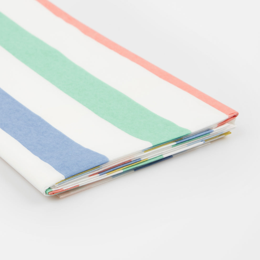 Our party tablecloth, made from laminated paper with colourful stripes, is great to add to your birthday party supplies.
