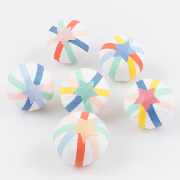 Our colourful surprise balls are the perfect way to give your guests a party hat, jokes and a special gift.