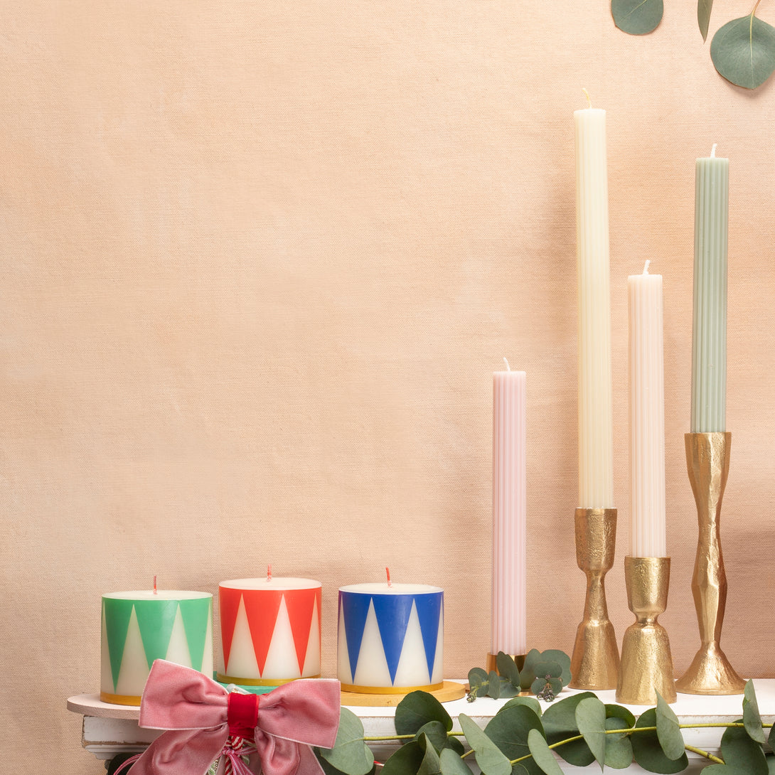 Our Christmas candle set of 3 candles have traditional Nutcracker designs of red, green and blue, with gold details and red wicks.