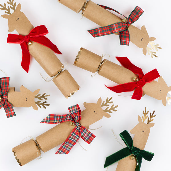 Our no-snap Christmas crackers feature reindeer with bow details in tartan and velvet, with a joke, party hat and small gift inside. Image4