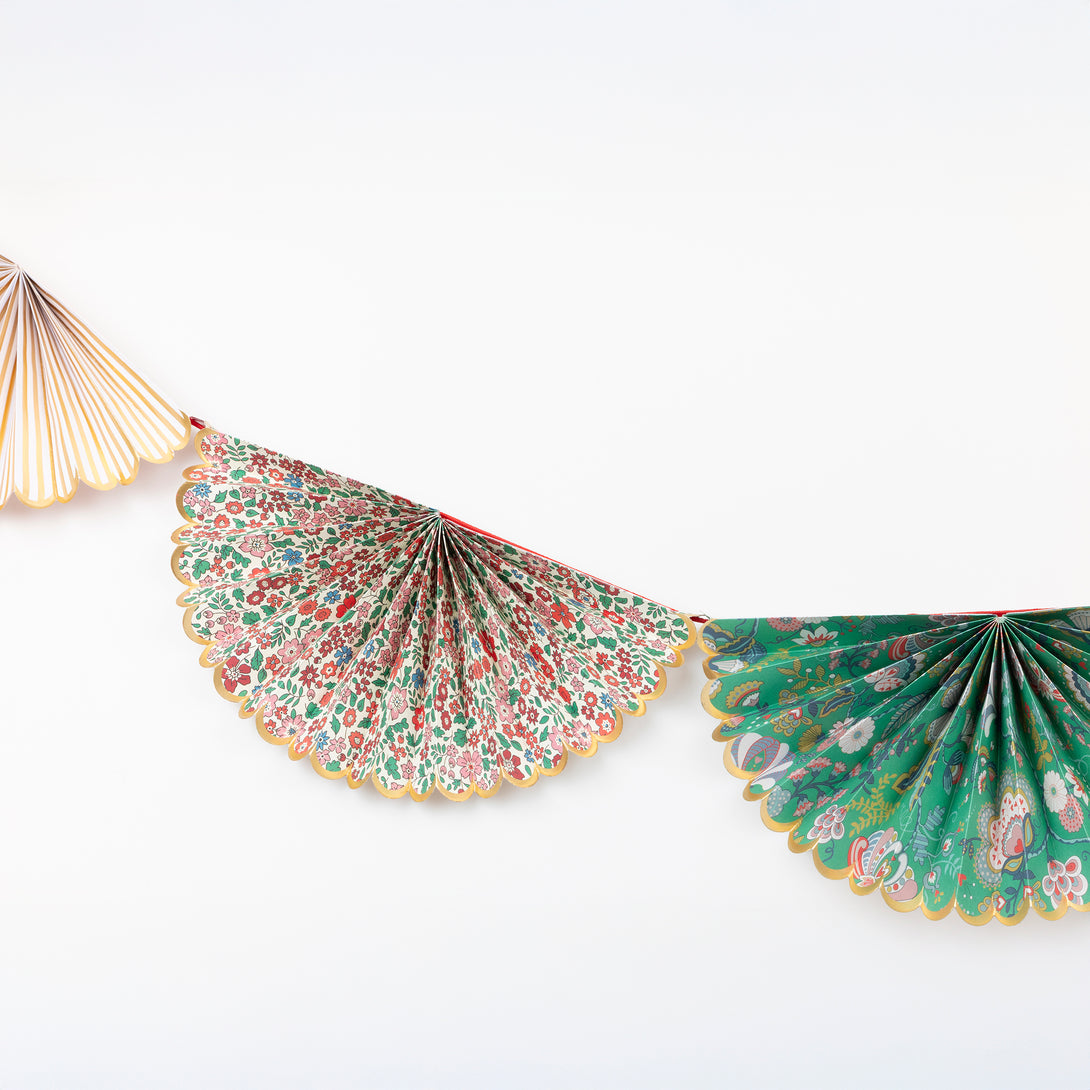 Our elegant Christmas garland has Liberty prints and matt gold foil details, pre-threaded on to a stylish red velvet ribbon. Image3