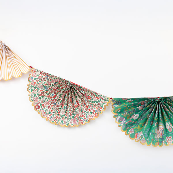 Our elegant Christmas garland has Liberty prints and matt gold foil details, pre-threaded on to a stylish red velvet ribbon. Image3