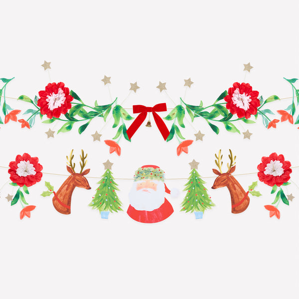 Our decorative set includes a Christmas garland with festive characters and another with foliage pennants, a velvet bow and a tinkling bell. Image1