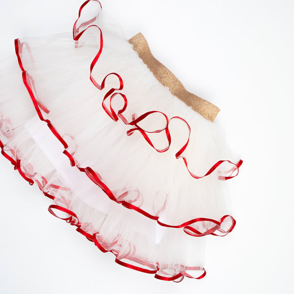 Make your kids look amazing this Christmas with a red and white Christmas costume of a velvet skirt, tulle jacket and red Santa hat. Image5