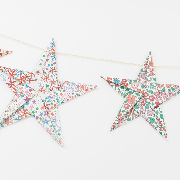 Let our star garland, designed with joyful Liberty star and floral prints and gold foil details, add an elegant touch to your Christmas décor. Image4
