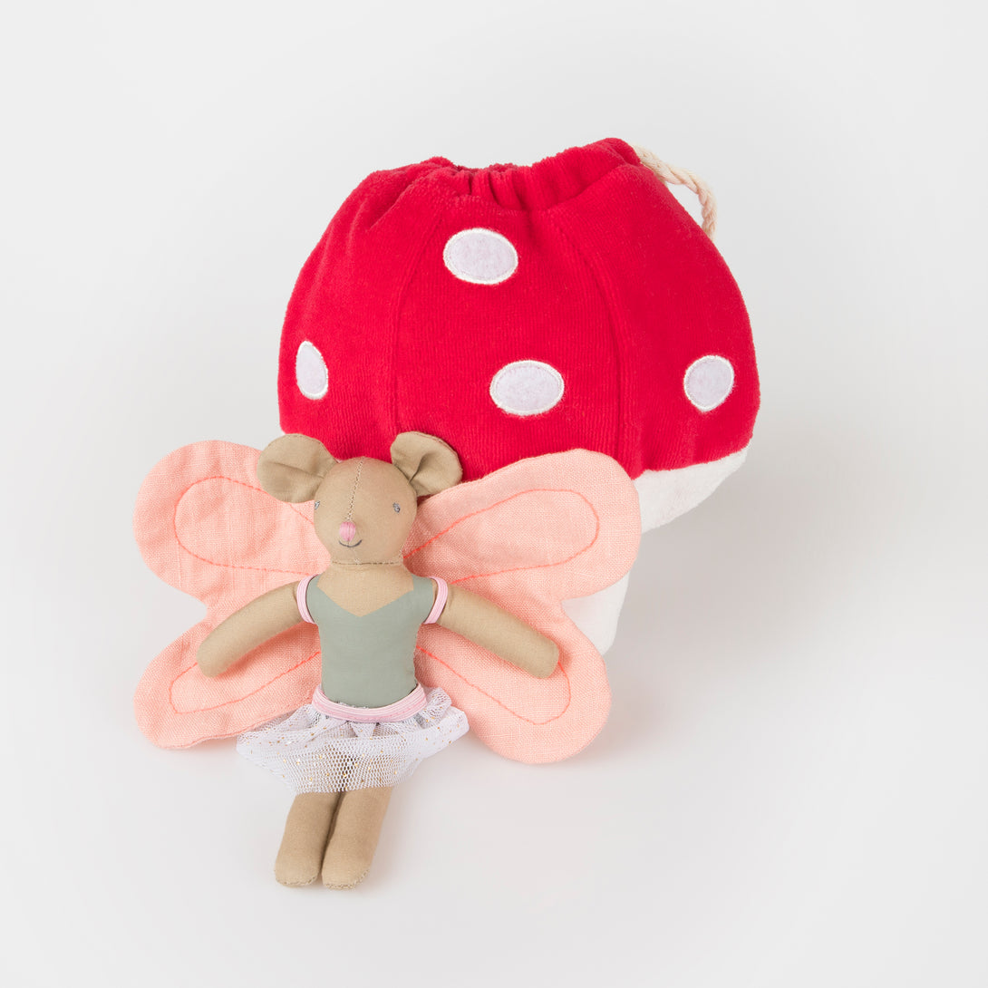 Our special play set includes a mini fabric mouse doll, with fairy wings, and a velvet mushroom drawstring pouch.