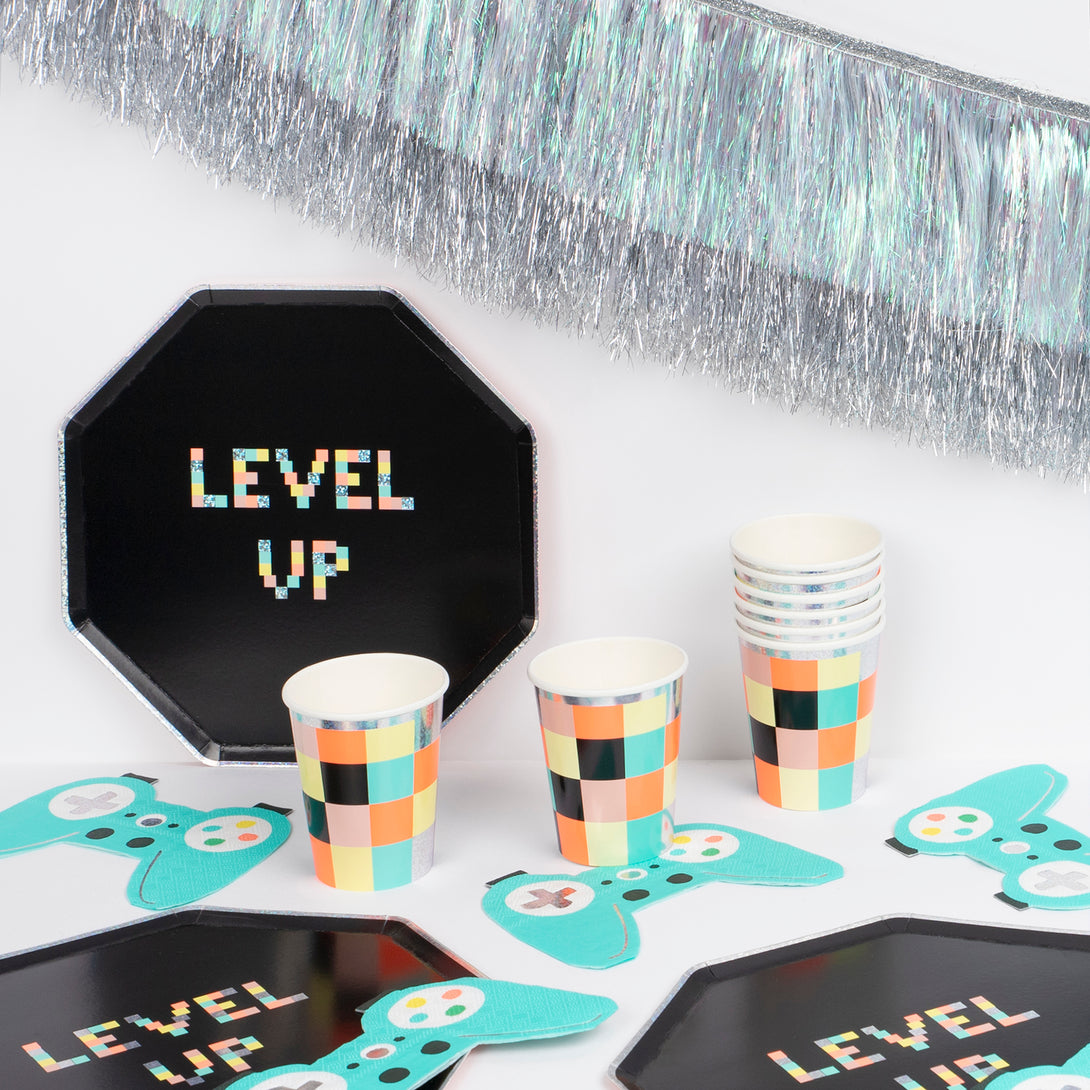 Throw a cool birthday party with a video theme with our set including paper plates, cups, napkins and an shimmering tinsel garland.  Image1