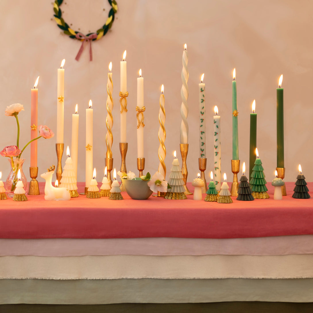 Use our Christmas table candles, with festive patterns and colours, to light up your dinner table or mantel. Image3