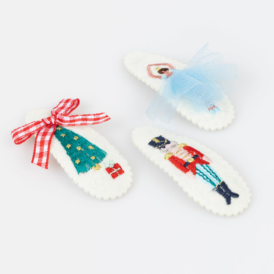 Our felt Christmas hair clips feature iconic Nutcracker characters, embroidered with embellishments, for a stylish look. Image2