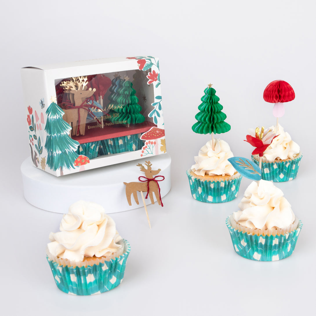 Our special Christmas cupcake kit contains woodland animals, flowers and Christmas tree toppers with striped cupcake cases.