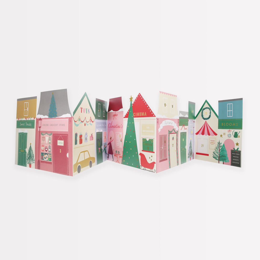 Our paper advent calendar is designed to look like Christmas street scene, with festive illustrations behind the windows and doors.