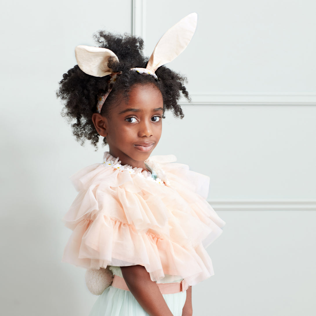 Our Easter costume, with bunny ears, a peach tulle cape and a pompom tail, is a wonderful Easter gift.