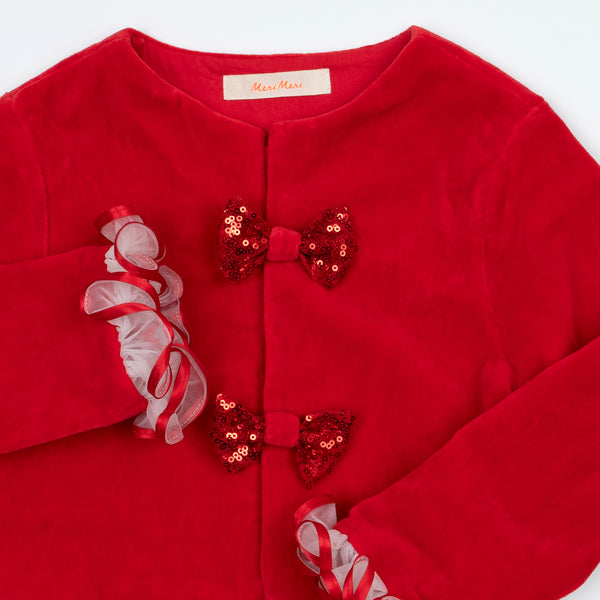 Make your kids look amazing this Christmas with a red and white Christmas costume of a velvet skirt, tulle jacket and red Santa hat. Image3