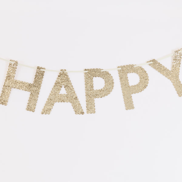 Our gold birthday garland, made from glitter fabric, is perfect to add to your birthday decorations, to reuse year after year. Image2