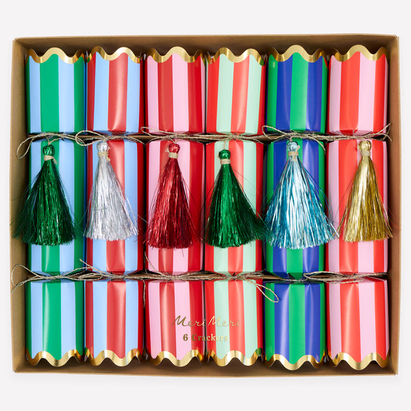 Our Christmas no-snap party crackers, with fun stripes and tinsel tassel details, contain a gold party hat, joke and a small gift. Image1