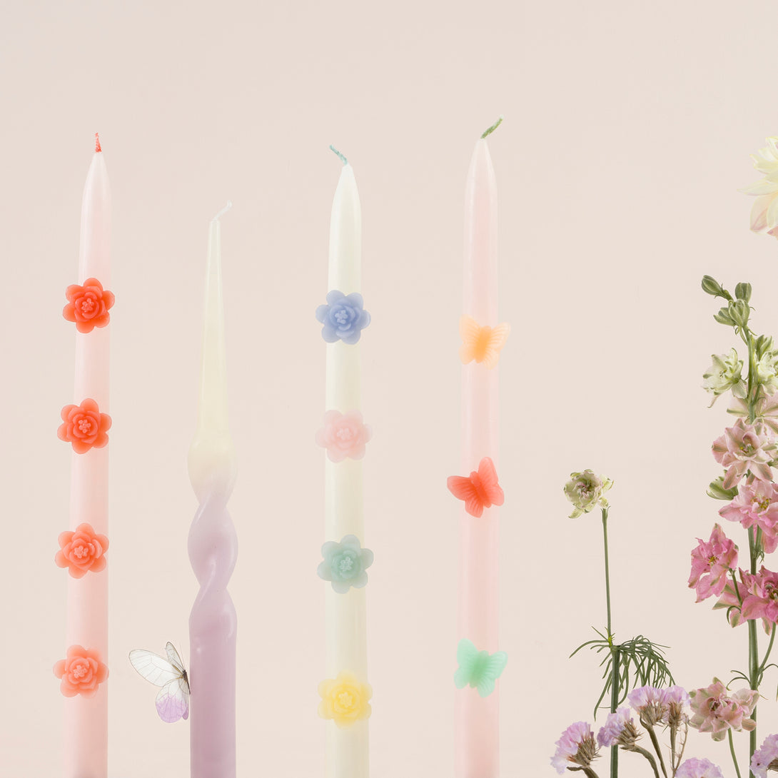 Our decorative candles are an elegant taper shape with 3D wax flowers. Image2