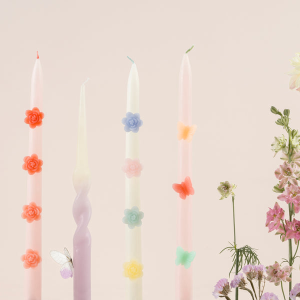 Our decorative candles are an elegant taper shape with 3D wax flowers. Image2