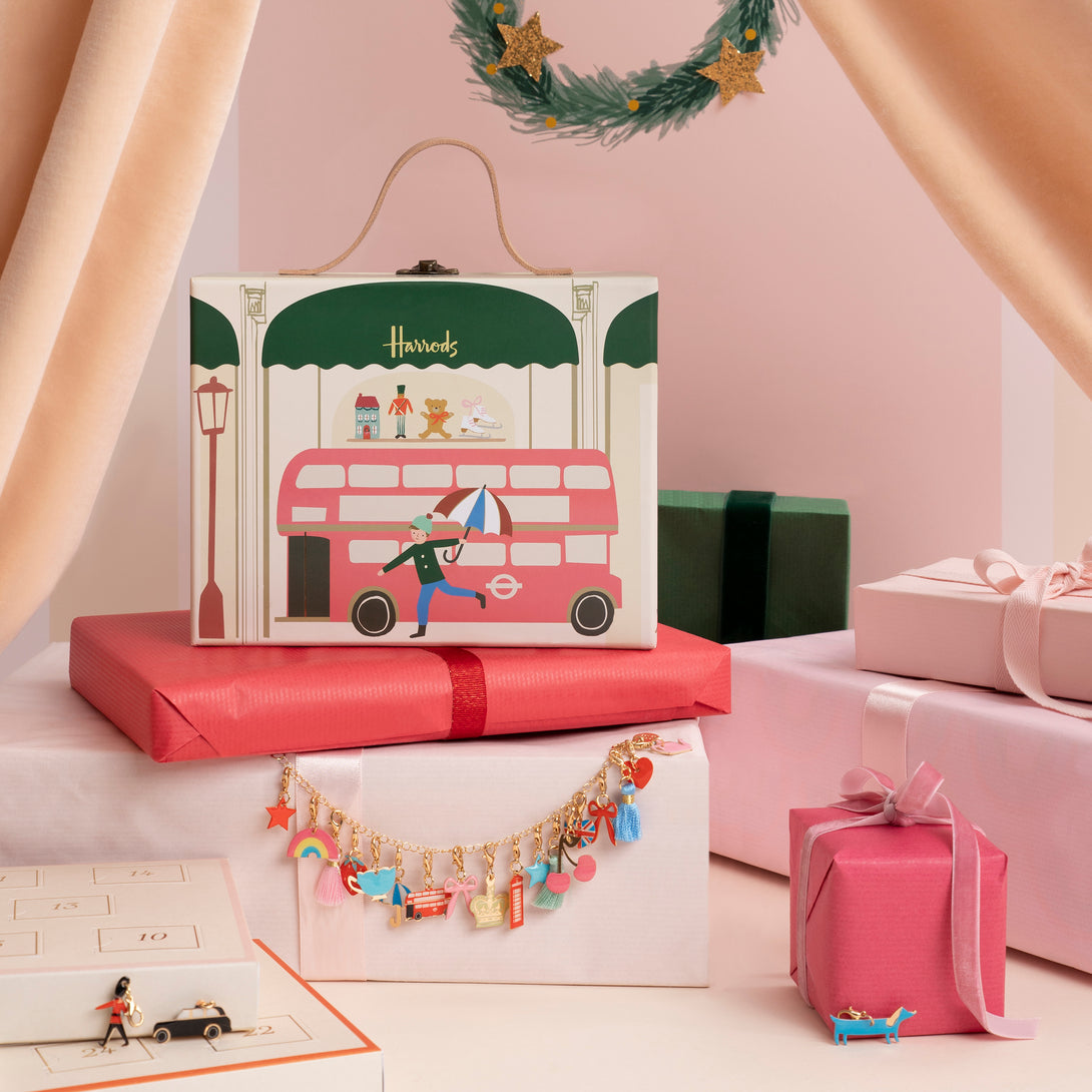 Our iconic Harrods mini suitcase includes an advent calendar where you'll get to create a charm bracelet over 24 days.