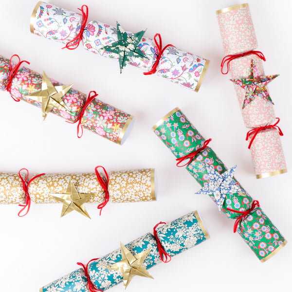 Make your Christmas dinner table look elegant with our luxury no snap Liberty crackers with velvet bows, origami stars and wonderful gifts. Image5