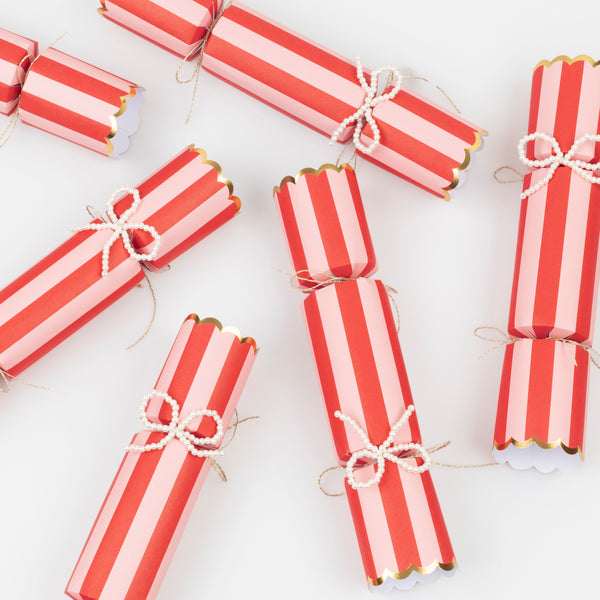Our striped Christmas crackers feature faux pearl bows, which can be used as tree decorations, and contain a paper hat, joke and gift. Image4