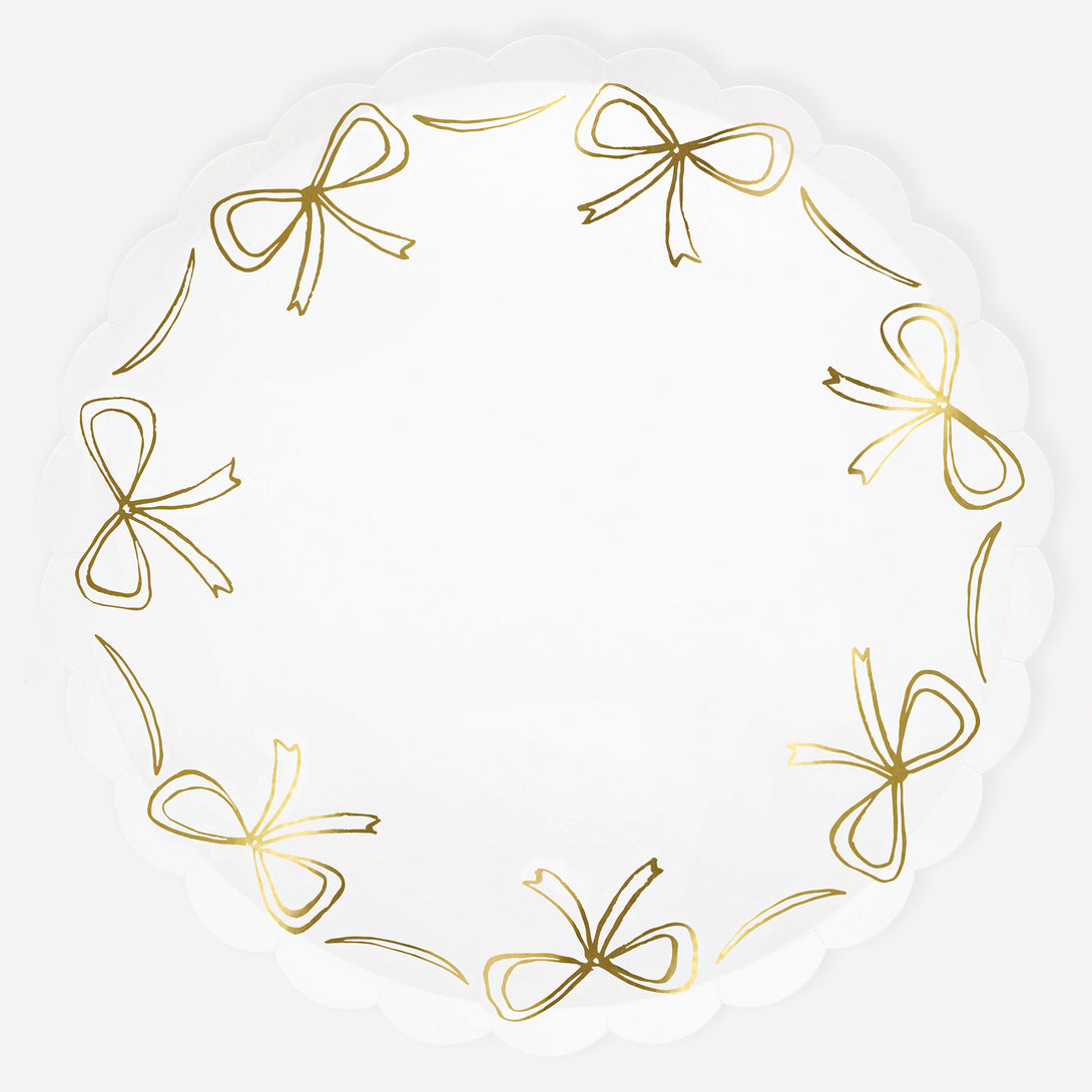 Add our stylish paper dinner plates to your Christmas party supplies, the gold bow design and scalloped border are so elegant. Image1