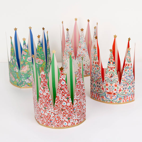 Our party crowns feature stylish Liberty floral prints, bold stripes on the inside, scalloped bands and gold foil stars, with an adjustable fit. Image1