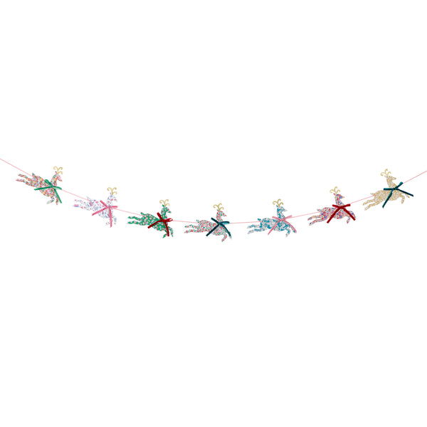 Our Christmas garland, featuring paper reindeers with elegant Liberty print designs and velvet ribbon bows, is perfect to reuse year after year. Image2