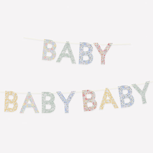 Our paper baby garland, made with classic Liberty designs in soft colours, is ideal for a baby shower or as a nursery decoration. Image1