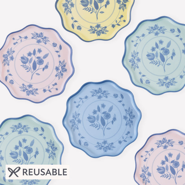 Our reusable plates, made from melamine in a small size, feature four pastel colours with a blue vintage botanical print design transfer. Image1