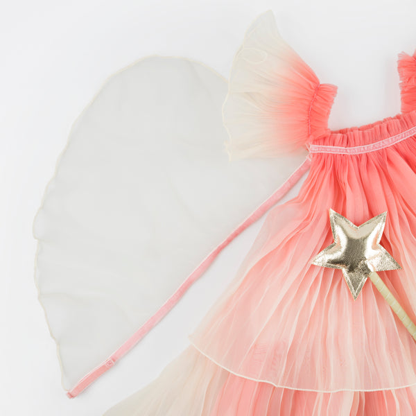 Our fairy costume includes a pink fairy dress and wings and a star wand. Image3
