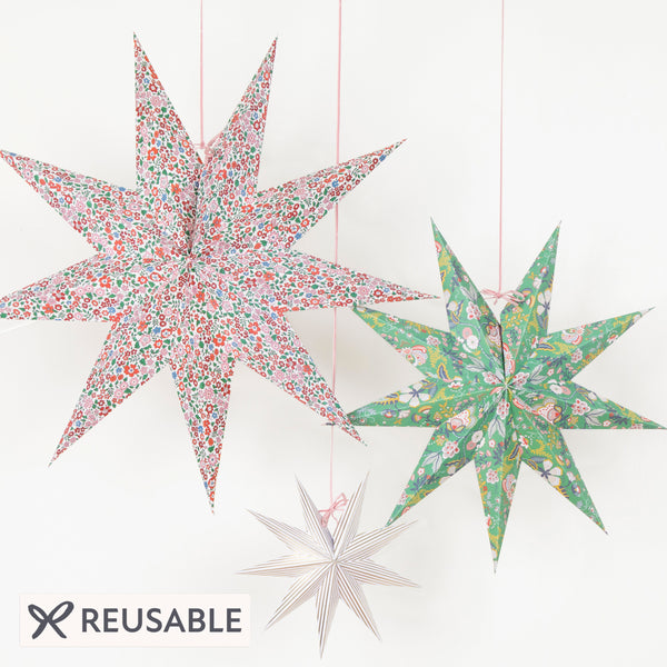 Our Christmas hanging decorations, in the shape of stylish 3D stars, feature beautiful Liberty floral prints in festive colours. Image1