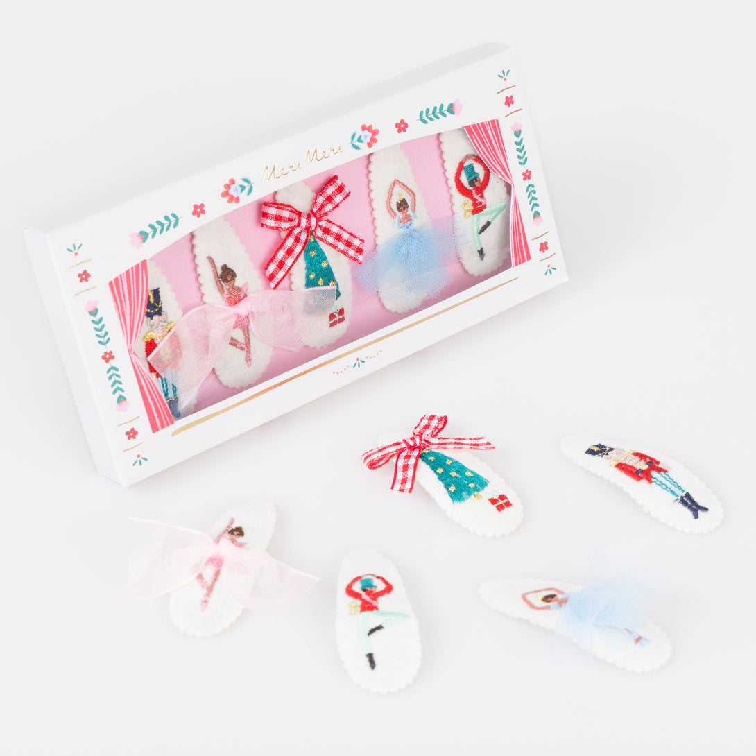 Our felt Christmas hair clips feature iconic Nutcracker characters, embroidered with embellishments, for a stylish look. Image1