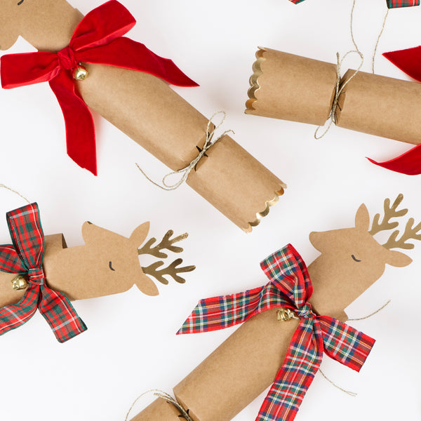 Our no-snap Christmas crackers feature reindeer with bow details in tartan and velvet, with a joke, party hat and small gift inside. Image3