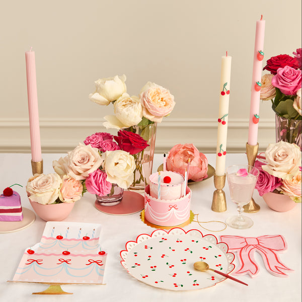 These table candles, with coloured wicks and cherry details, are ideal as a host gift or when you're looking for decorative candles. Image2