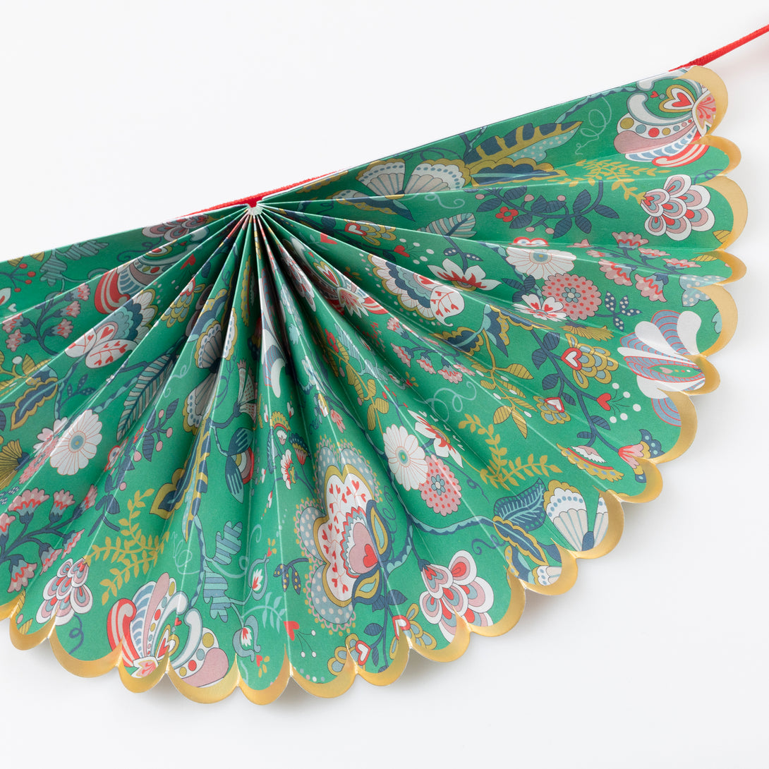 Our elegant Christmas garland has Liberty prints and matt gold foil details, pre-threaded on to a stylish red velvet ribbon. Image4