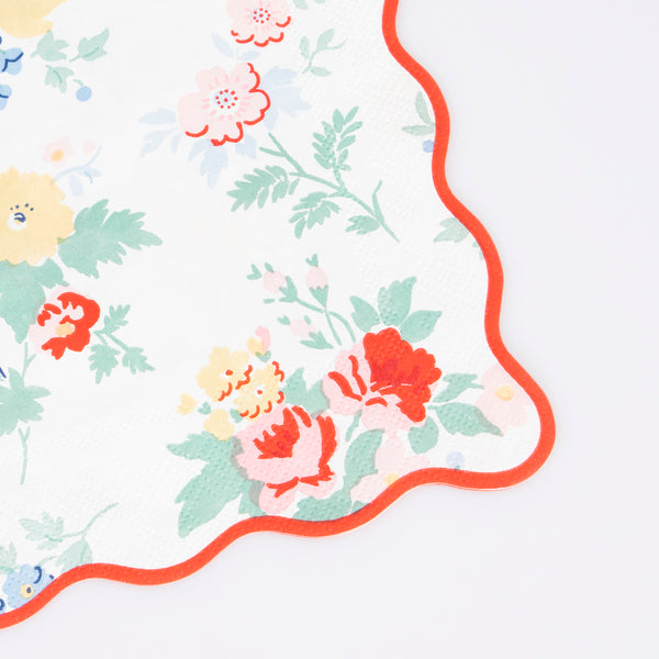 Our paper napkins feature a vintage floral design, with pops of red, to make any party table look effortlessly sophisticated. Image3