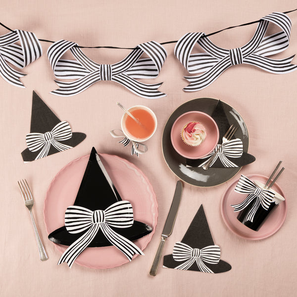 Keep your Halloween stylish with our set of Halloween party supplies including a bow garland, bow cups, witch hat plates and napkins. 