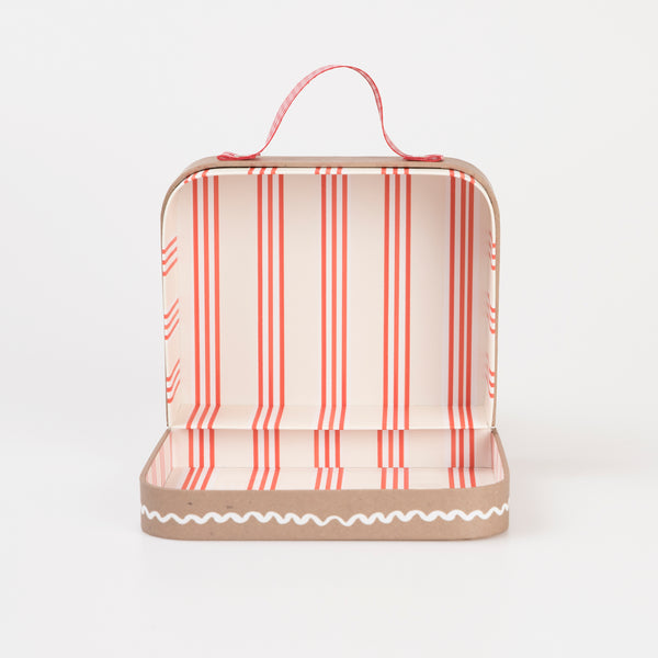 Our Christmas doll set includes a mini fabric reindeer doll in a laminated mini suitcase designed to look like a gingerbread house. Image5