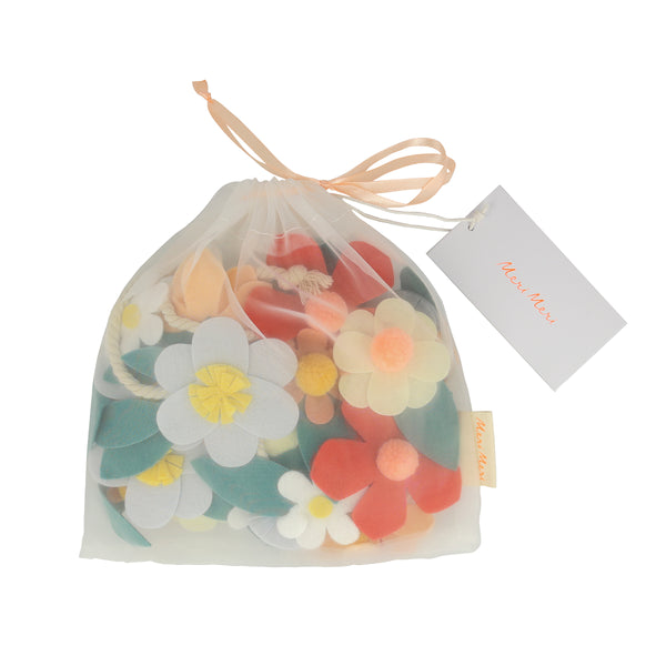 Our special party garland is crafted from felt, with flowers with pompom centres. Image6